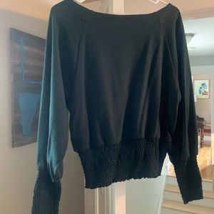 Emerald green sweater.